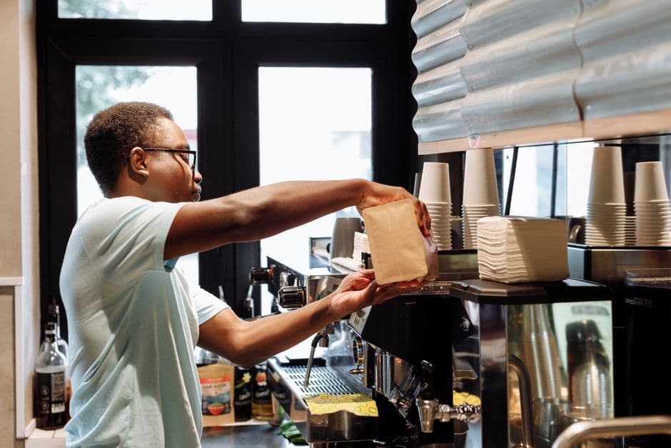 A bag in hand at the bar, mid-service