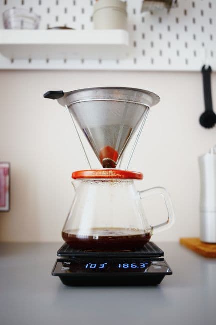 A pour-over brewing on the scale